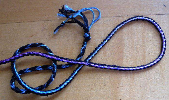 3-loop fingerloop braid of bicolor loops. Variegated rayon, and cotton embroidery floss (doubled). loopbraider.com