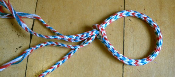 Sudarium-type braid, same colors in both sub-braids Sudarium-type braid, finger loop braiding, 16 loops, embroidery floss