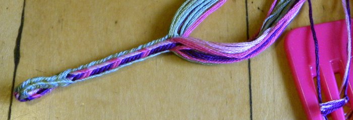 in-progress Sudarium-type loop braid, 16 loops, embr. floss