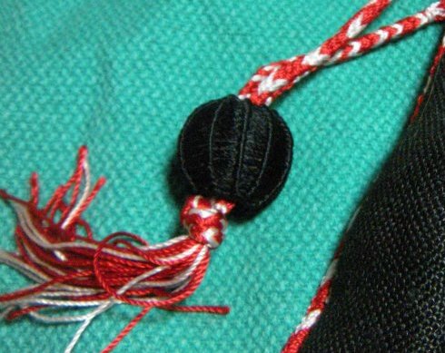 Julie's ball button on finger loop braid