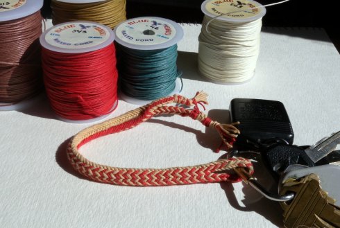 waxed cotton cord, 12-loop double braid, hollow variation 12-loop fingerloop braid, double braid structure (hollow braid with linked exchanges)