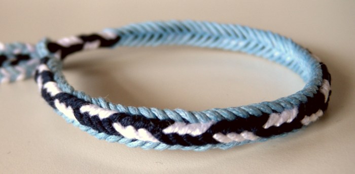 Bracelet made with unorthodox fingerloop braid of 7 loops, half the strands of waxed cotton cord