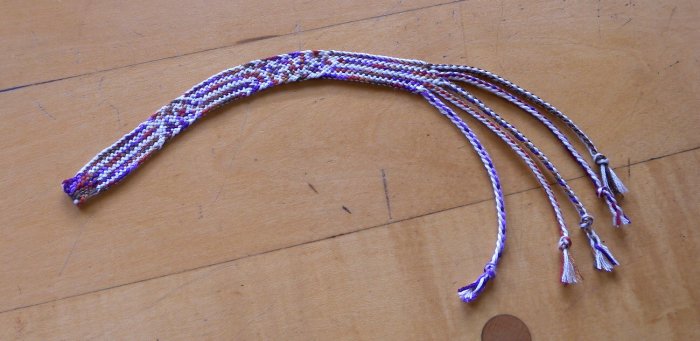 Loop braid made with POT (Plain Oblique Twining), 'Rainbow Girl' braid, cotton embroidery floss by Ingrid Crickmore, loopbraider.com